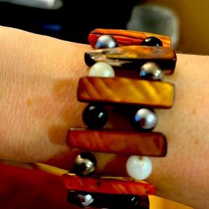 Handmade stretch bracelet with brown long shell beads with pearl beads